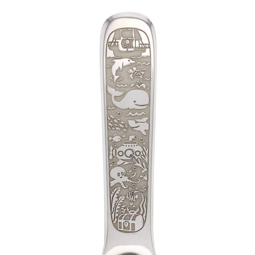ocean engraving detail of silver baby spoon