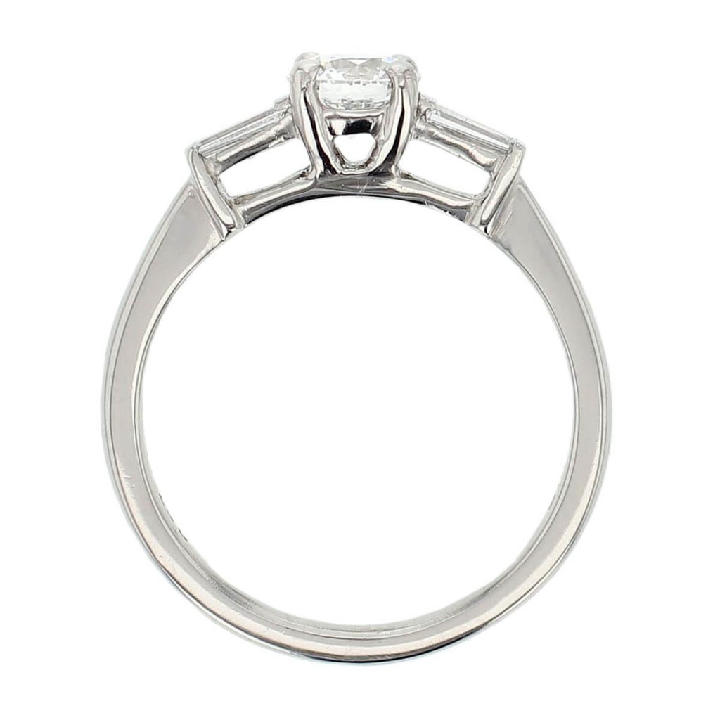 round cut diamond trilogy engagement ring, tapered baguette side diamonds, platinum designer handmade by Faller, hand crafted, betrothal, promise, precious jewellery, jewelry, GIA certified, hand crafted, G.I.A. GIA, three stone