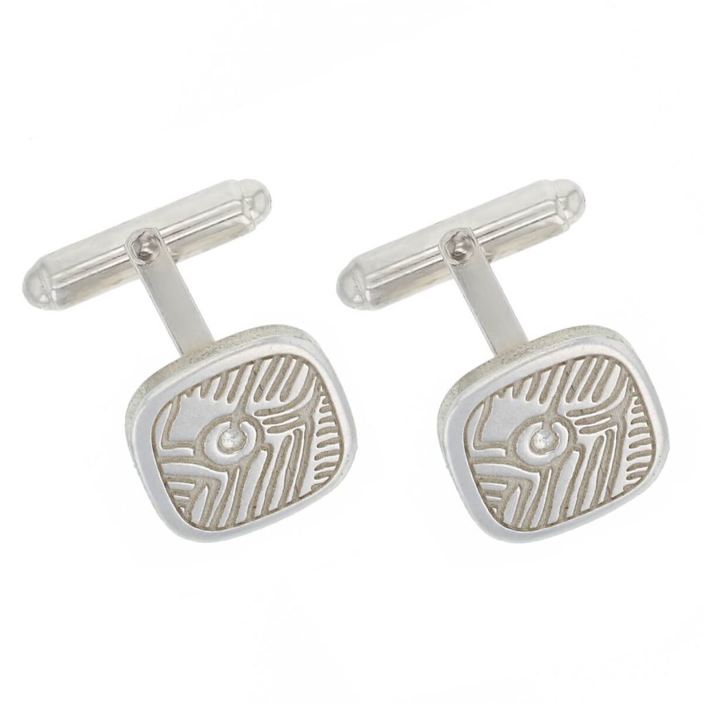 Prehistoric rock art, Isle of Doagh sterling silver cufflinks angled to show silver fittings