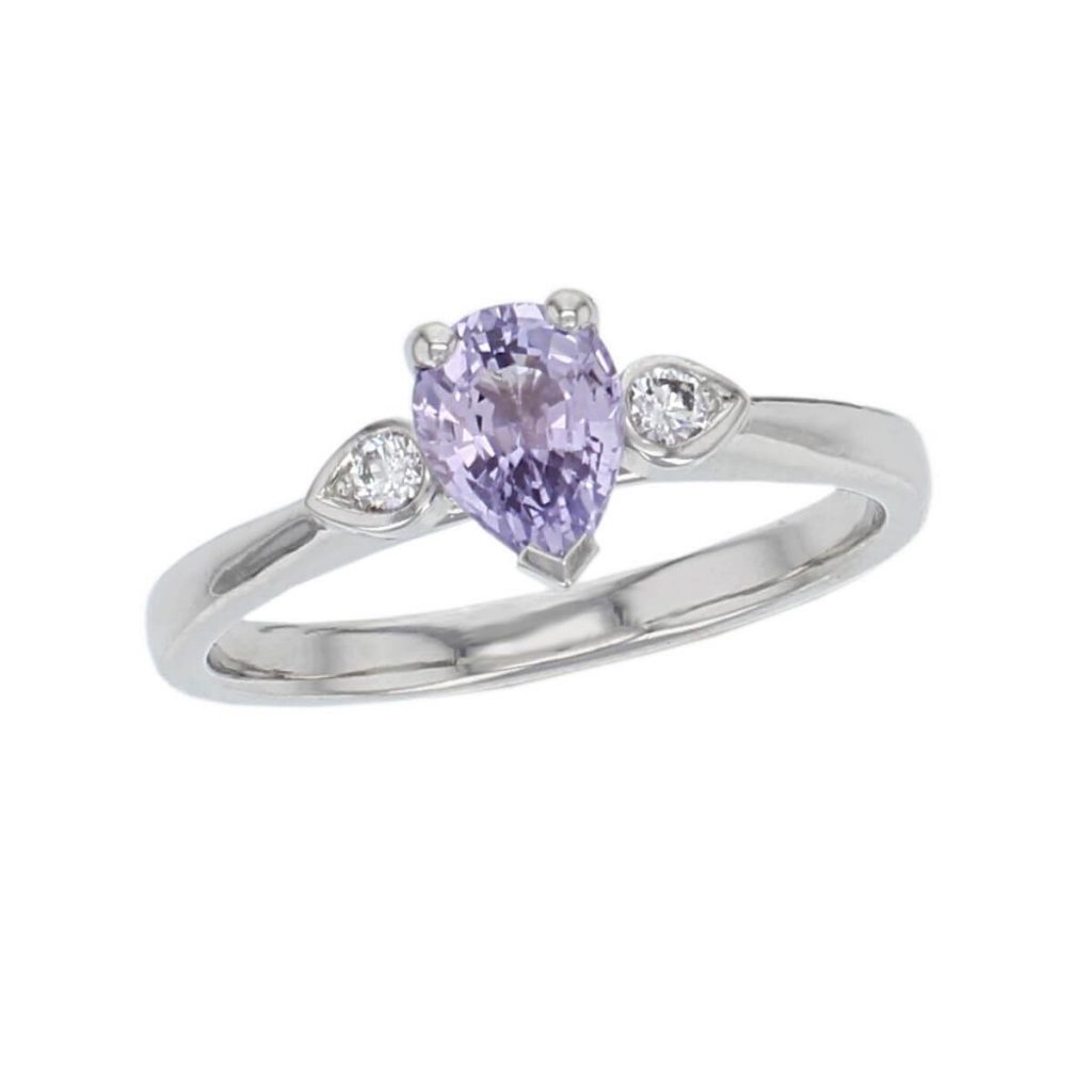 alternative engagement ring, platinum round brilliant cut diamond & pear cut purple sapphire trilogy ring designer three stone dress ring handmade by Faller, hand crafted, precious jewellery, jewelry, ladies , woman