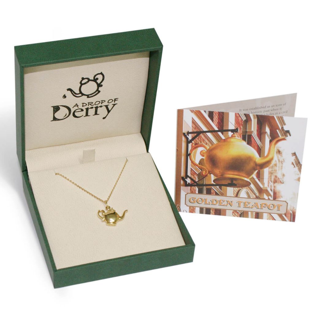 Golden teapot necklace in faller box