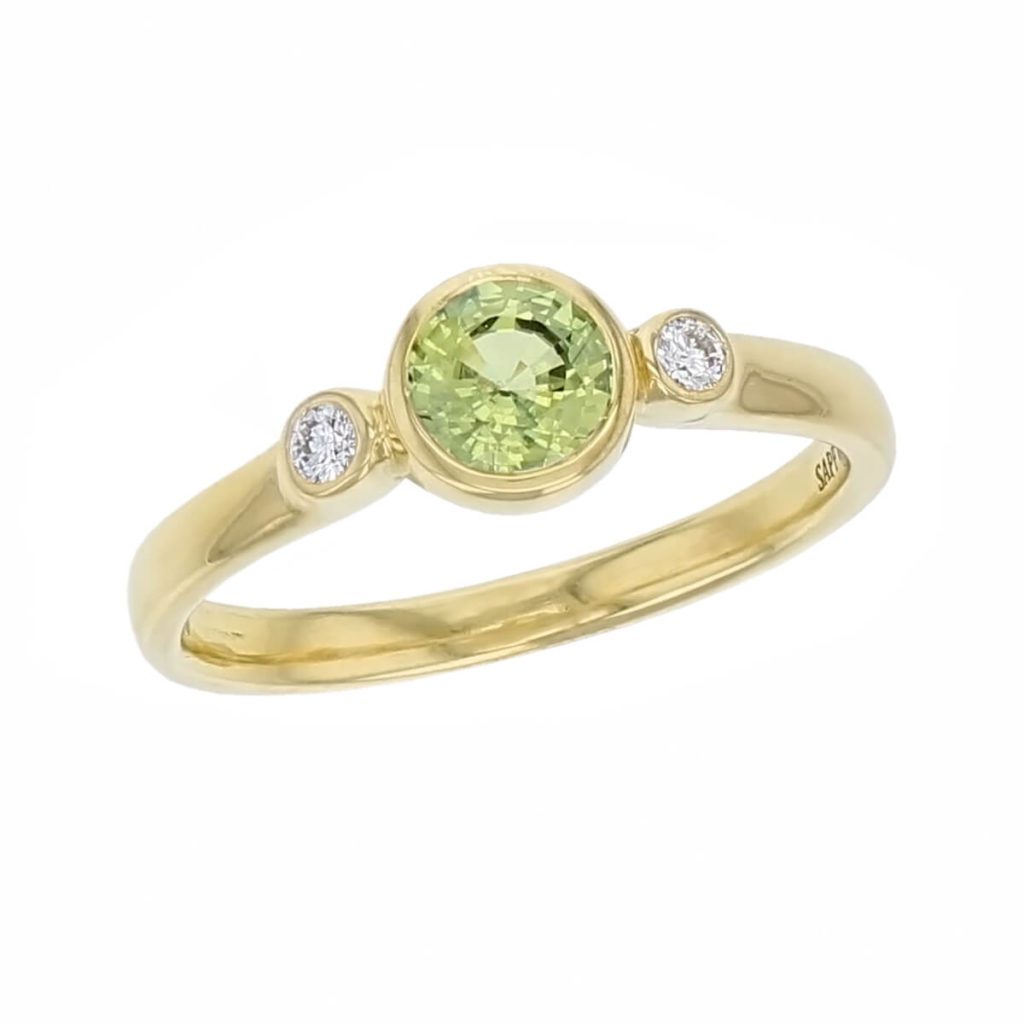 18ct yellow gold round brilliant cut diamond & round cut green sapphire trilogy ring designer three stone dress ring handmade by Faller, hand crafted, precious jewellery, jewelry, ladies , woman