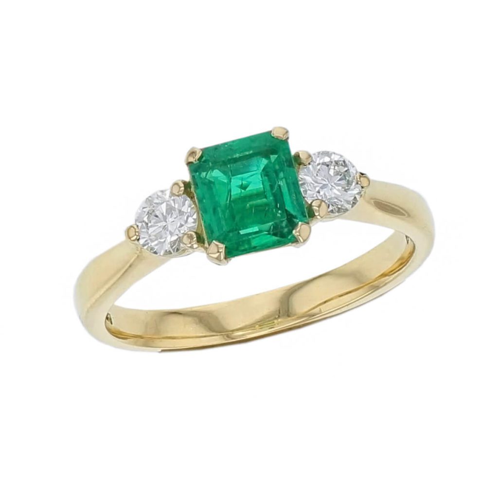 alternative engagement ring, 18ct yellow gold ladies octagon cut emerald & diamond designer trilogy engagement ring designed & hand crafted by Faller of Derry/ Londonderry, trilogy dress ring, precious green gem jewellery, jewelry