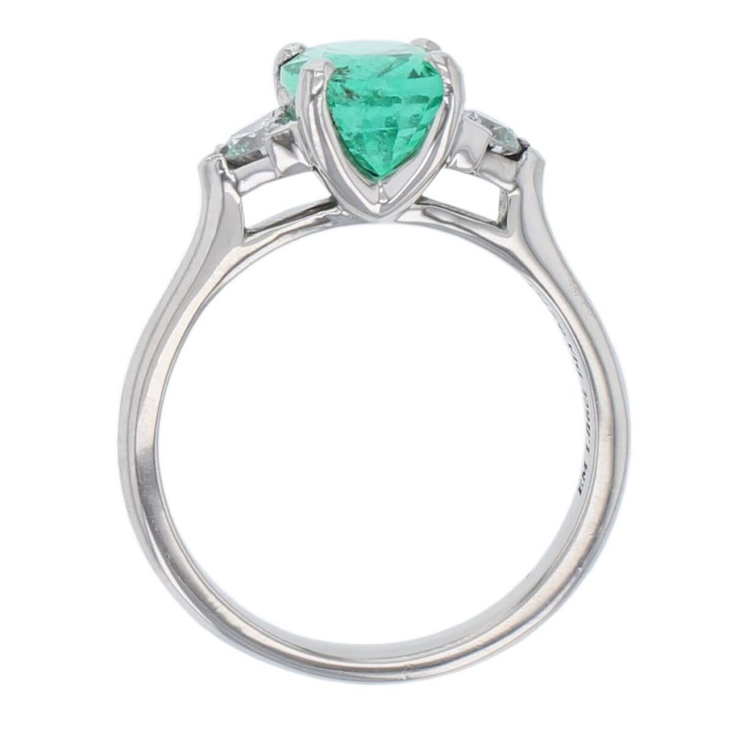 alternative engagement ring, platinum ladies oval cut emerald & diamond designer trilogy ring designed & hand crafted by Faller of Derry/ Londonderry, dress ring, precious green gem jewellery, jewelry