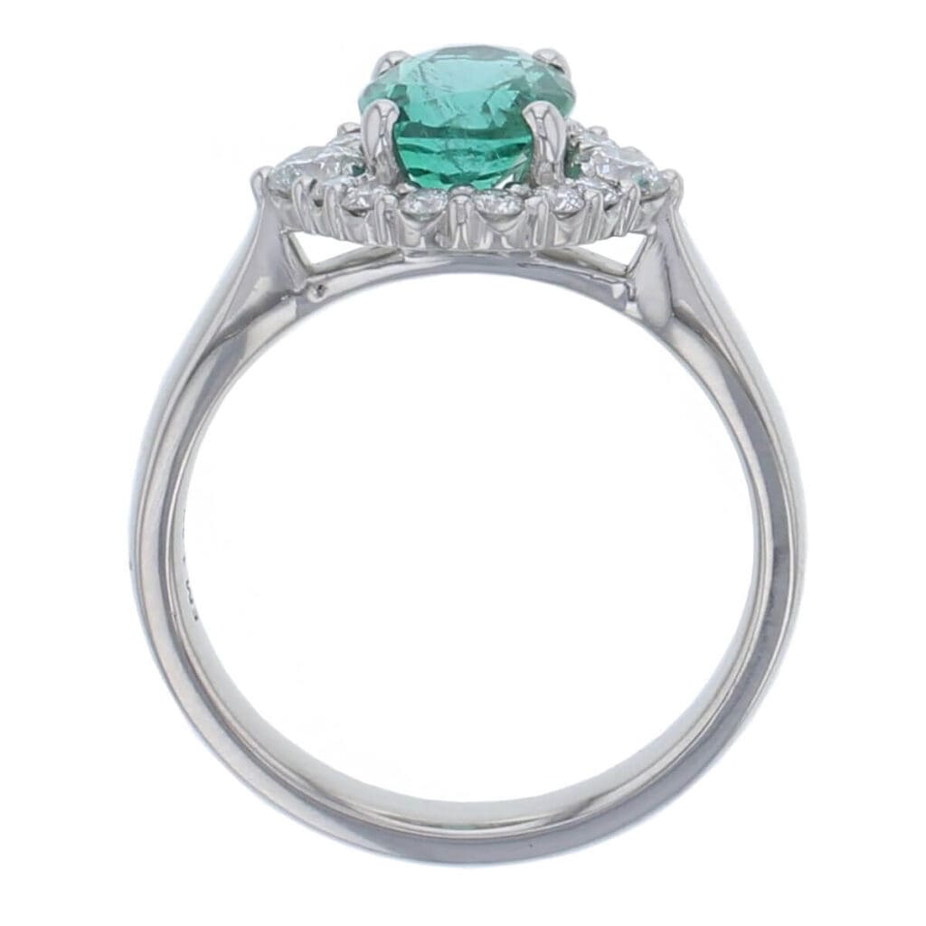 alternative engagement ring, platinum ladies oval cut emerald & diamond designer cluster/halo engagement ring designed & hand crafted by Faller of Derry/ Londonderry, cluster/halo dress ring, precious green gem jewellery