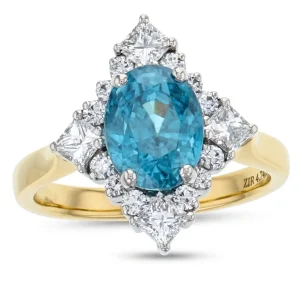 18ct yellow gold ladies oval cut blue zircon & diamond designer ring designed & hand crafted by Faller of Derry/ Londonderry, cluster/halo dress ring