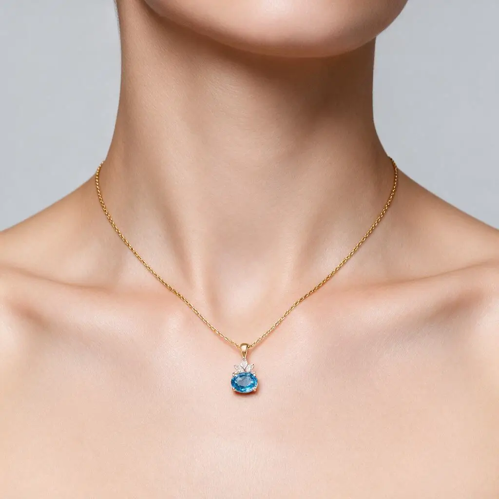 Oval cut blue topaz & diamond 18ct yellow gold & platinum pendant