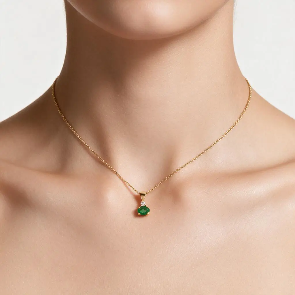 18ct yellow gold ladies oval cut emerald & diamond pendant